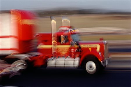 simsearch:700-00068576,k - Red Truck in Motion Stock Photo - Rights-Managed, Code: 700-00006078