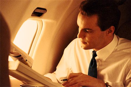 Busnessman in Airplane Stock Photo - Rights-Managed, Code: 700-00007863