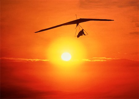 simsearch:700-00150473,k - Silhouette of Hang Gliding at Sunset Stock Photo - Rights-Managed, Code: 700-00009734