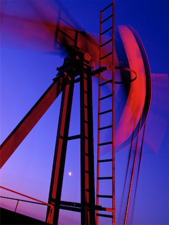 simsearch:700-08683758,k - Oilfield Pumpjack in Motion at Sunset Near Drayton, Alberta, Canada Stock Photo - Rights-Managed, Code: 700-00014017