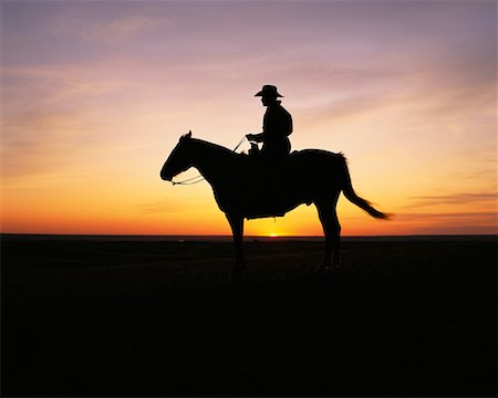 Silhouette of Cowboy on Horse at Sunset, Grasslands National Park Saskatchewan, Canada Stock Photo - Rights-Managed, Code: 700-00015081