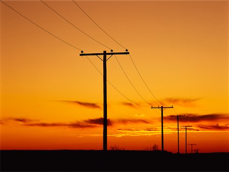 saskatchewan silo photos - Silhouette of Telephone Poles at Sunset, Near Val Marie Saskatchewan, Canada Stock Photo - Rights-Managed, Code: 700-00015464