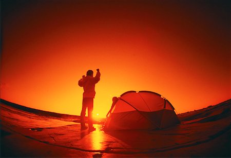 pictures of people camping in the northwest territories - Back View of Man Standing near Tent at Sunset Northwest Territories, Canada Stock Photo - Rights-Managed, Code: 700-00015610