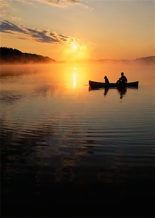 Silhouette of People in Boat on Lake Chandos at Sunset Ontario, Canada Stock Photo - Rights-Managed, Code: 700-00016016