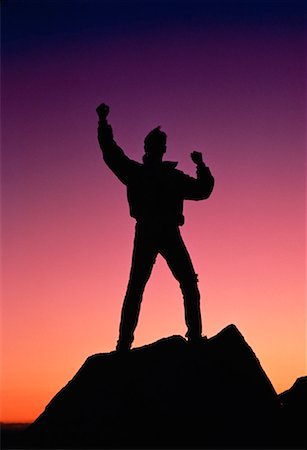 silhouette of man standing in a mountain top - Silhouette of Man on Top of Mountain Stock Photo - Rights-Managed, Code: 700-00016186