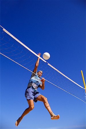 simsearch:632-01155154,k - Male Volleyball Player Spiking Ball Stock Photo - Rights-Managed, Code: 700-00017702