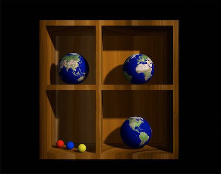 Three Globes on a Shelf Displaying Continents of the World Stock Photo - Rights-Managed, Code: 700-00017742