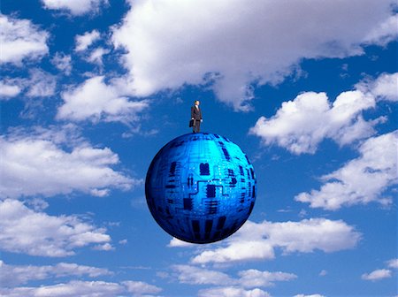 simsearch:700-00042054,k - Man Standing on Circuit Board Sphere with Clouds Stock Photo - Rights-Managed, Code: 700-00017867