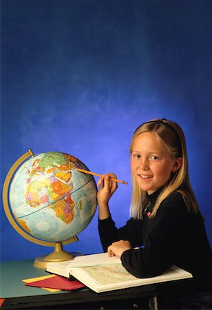 Student with Globe and Atlas Stock Photo - Rights-Managed, Code: 700-00012749