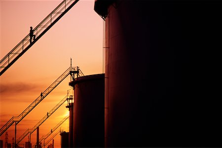 silo alberta - Workers on Staircases of Oil Storage Tanks at Sunset Near Edmonton, Alberta, Canada Stock Photo - Rights-Managed, Code: 700-00013182