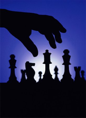 simsearch:700-00075674,k - Silhouette of Hand and Chess Pieces Stock Photo - Rights-Managed, Code: 700-00013910