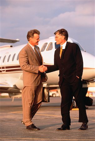 Businessmen Shaking Hands on Tarmac Stock Photo - Rights-Managed, Code: 700-00024808