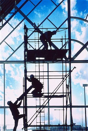 simsearch:700-00030097,k - Silhouette of Construction Workers on Scaffolding Stock Photo - Rights-Managed, Code: 700-00026221