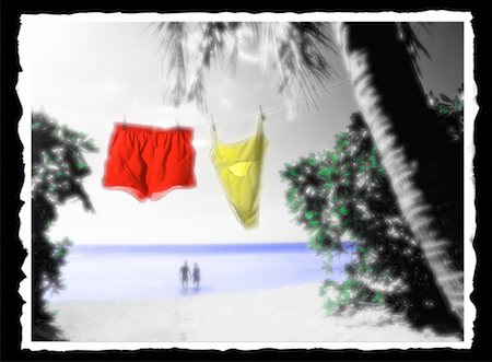 skinny-dipping - Bathing Suits on Clothesline And Couple in Ocean Stock Photo - Rights-Managed, Code: 700-00026345