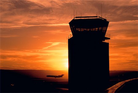 Silhouette of Air Traffic Control Tower at Sunset Stock Photo - Rights-Managed, Code: 700-00026690