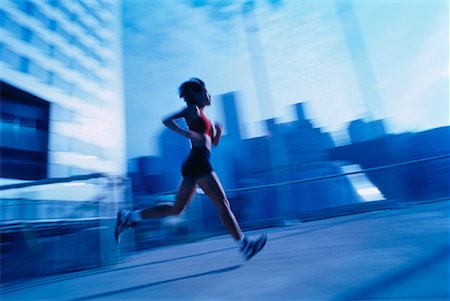 peter griffith - Blurred View of Woman Running Outdoors Stock Photo - Rights-Managed, Code: 700-00026974