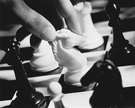 simsearch:700-00075674,k - Close-Up of Hand Moving Chess Piece Stock Photo - Rights-Managed, Code: 700-00028179