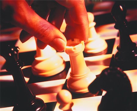 simsearch:700-00284729,k - Close-Up of Hand Moving Chess Piece Stock Photo - Rights-Managed, Code: 700-00028462
