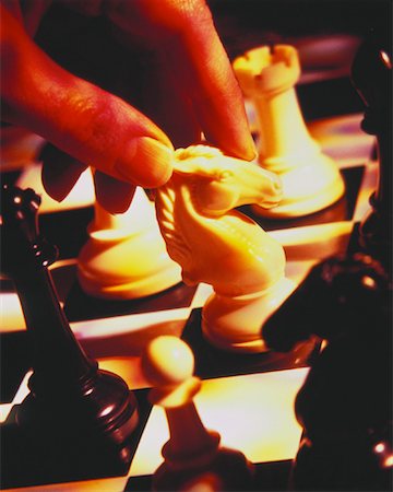 simsearch:700-00075674,k - Close-Up of Hand Moving Chess Piece Stock Photo - Rights-Managed, Code: 700-00028463