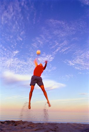 simsearch:632-01155154,k - Man Jumping, Playing Beach Volleyball Stock Photo - Rights-Managed, Code: 700-00029244