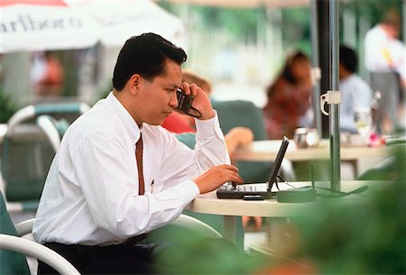 simsearch:700-00163379,k - Businessman Using Cellular Telephone Kuala Lumpur, Malaysia Stock Photo - Rights-Managed, Code: 700-00029391