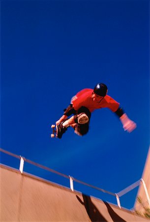 simsearch:400-05737917,k - Skateboarder on Halfpipe Stock Photo - Rights-Managed, Code: 700-00029495