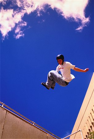 simsearch:400-05737917,k - Man In-Line Skating on Halfpipe Stock Photo - Rights-Managed, Code: 700-00029497