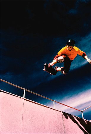 simsearch:400-05737917,k - Skateboarder on Halfpipe Stock Photo - Rights-Managed, Code: 700-00029500
