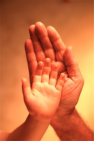 Child's Hand in Front of Man's Hand Stock Photo - Rights-Managed, Code: 700-00029604