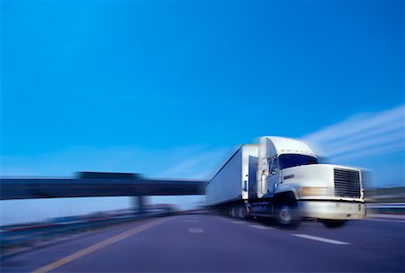 simsearch:700-00068576,k - Blurred View of Transport Truck On Highway Stock Photo - Rights-Managed, Code: 700-00021263
