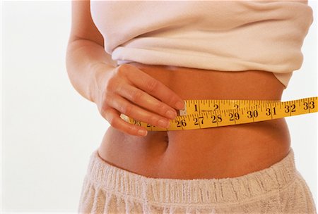 simsearch:700-00021673,k - Close-Up of Woman Measuring Waist Stock Photo - Rights-Managed, Code: 700-00021548