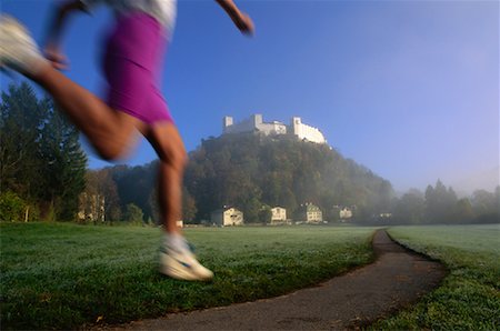 Woman Running and Salzburg Castle Salzburg, Austria Stock Photo - Rights-Managed, Code: 700-00022536