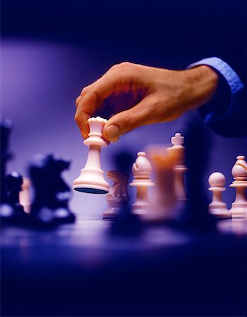 simsearch:700-00075674,k - Man's Hand Moving Chess Piece Stock Photo - Rights-Managed, Code: 700-00023333