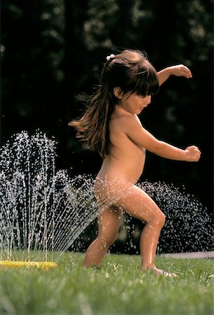 Nude Girl Playing in Sprinkler Stock Photo - Rights-Managed, Code: 700-00023347