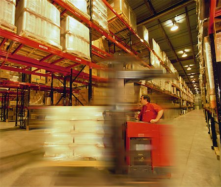simsearch:700-00034776,k - Man Operating Forklift in Warehouse Stock Photo - Rights-Managed, Code: 700-00034763