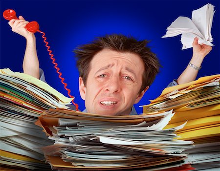 simsearch:700-00035269,k - Portrait of Businessman Behind Paperwork Stock Photo - Rights-Managed, Code: 700-00034926