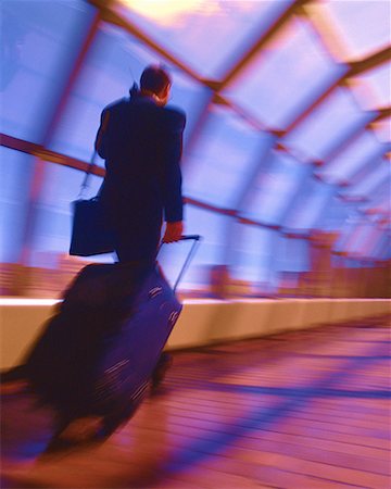 simsearch:700-03058969,k - Businessman with Luggage and Cell Phone, Calgary, Alberta, Canada Stock Photo - Rights-Managed, Code: 700-00035127