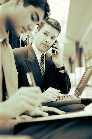 simsearch:700-00163379,k - Businessman Using Cell Phone and Laptop Computer Stock Photo - Rights-Managed, Code: 700-00035283