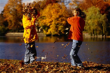 Children Playing in Autumn Leaves Stock Photo - Rights-Managed, Code: 700-00036953
