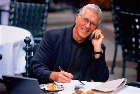 simsearch:700-00163379,k - Portrait of Mature Businessman Using Cell Phone at Outdoor Cafe Stock Photo - Rights-Managed, Code: 700-00037320