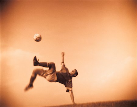 simsearch:700-00035072,k - Soccer Player Jumping to Kick Ball Stock Photo - Rights-Managed, Code: 700-00038145