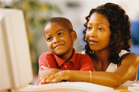 Female Teacher and Boy Using Computer in Classroom Stock Photo - Rights-Managed, Code: 700-00038959