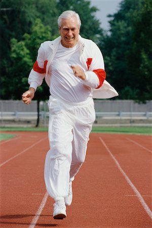 simsearch:400-04535435,k - Mature Man Running on Track Stock Photo - Rights-Managed, Code: 700-00039110