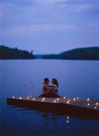 secluded lake woman - Couple Embracing on Dock by Candlelight at Dusk Stock Photo - Rights-Managed, Code: 700-00039330