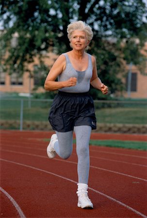 simsearch:400-04535435,k - Mature Woman Running on Track Stock Photo - Rights-Managed, Code: 700-00039606
