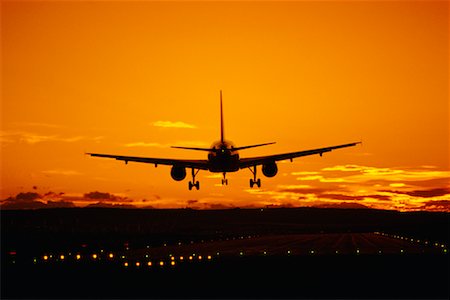 simsearch:700-05641925,k - Airplane Landing at Sunset Calgary International Airport Calgary, Alberta, Canada Stock Photo - Rights-Managed, Code: 700-00039722