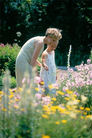 Grandmother with Granddaughter Looking at Flowers Stock Photo - Rights-Managed, Code: 700-00030171