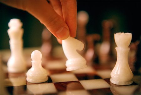 simsearch:700-00075674,k - Close-Up of Hand Moving Chess Piece Stock Photo - Rights-Managed, Code: 700-00030271