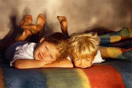 Portrait of Boy and Girl Lying On Blanket Foto de stock - Con derechos protegidos, Código: 700-00031383