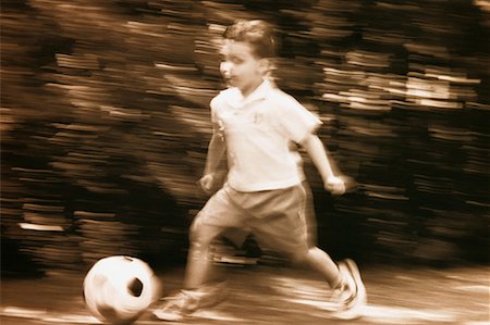 simsearch:700-00035072,k - Blurred View of Boy Playing Soccer Stock Photo - Rights-Managed, Code: 700-00031459